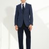 Look Scavini complet avec pantalon velours bleu marine et veste tweed bleu.